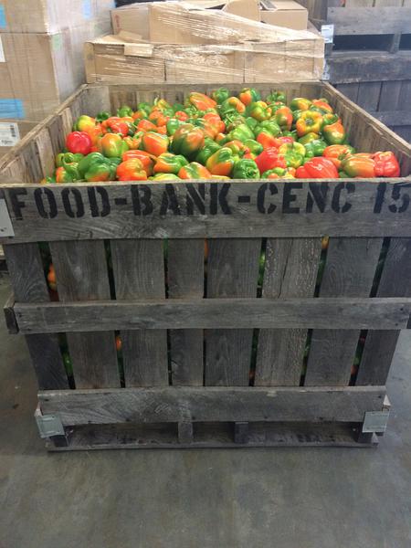 A crate of peppers at a food bank.